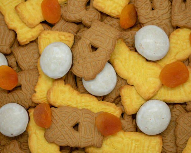 istock Christmas background from speculoos, pepper nuts and dried apricots 1057339096
