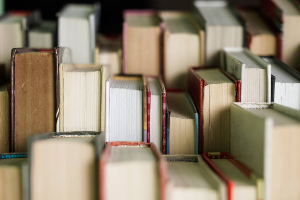 Stack of books background. many books piles.