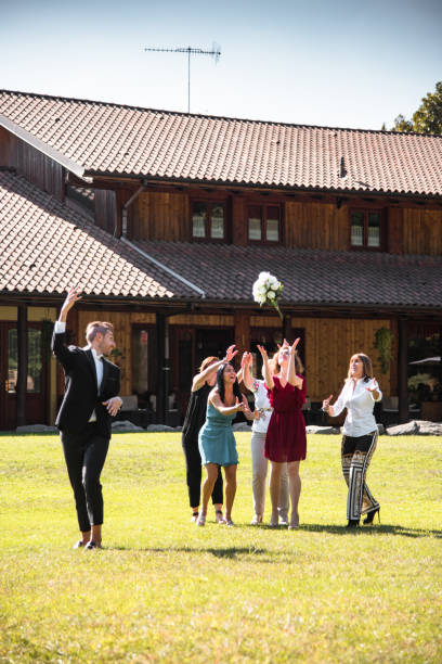 istock throwing the bouquet at the gay wedding 1057343716
