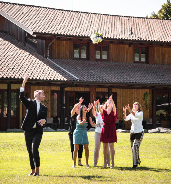 istock throwing the bouquet at the gay wedding 1057343720