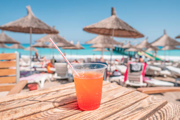 istock juice color cocktail during touristic vacation. umbrellas 1057350118