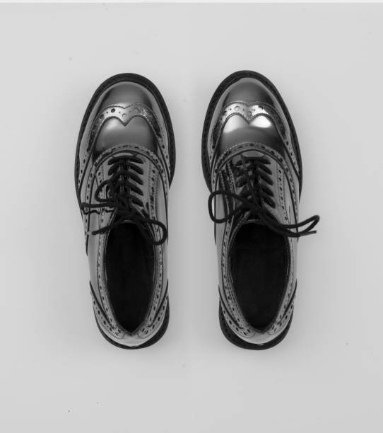 istock silver metallic women budapester shoes isolated on white grey background 1057355458