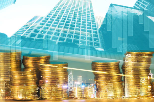 istock Double exposure Stack of coin with financial graph over city and office building background, business and financial concept. 1057358934