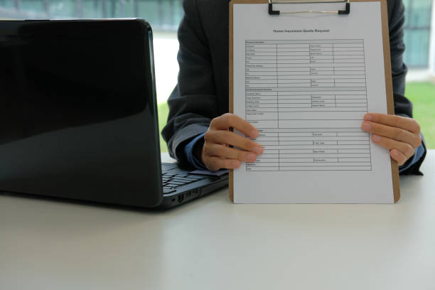 istock businessman showing home insurance quote request 1057360792