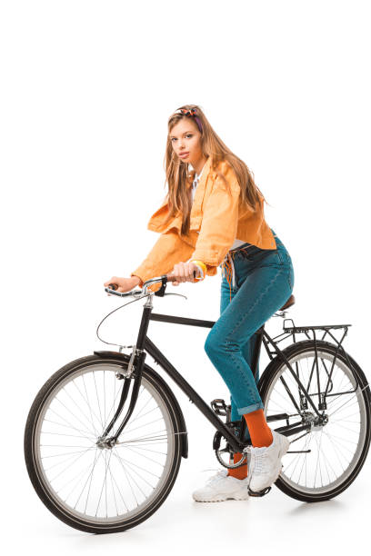istock hipster girl sitting on bicycle and looking at camera  isolated on white 1057362724