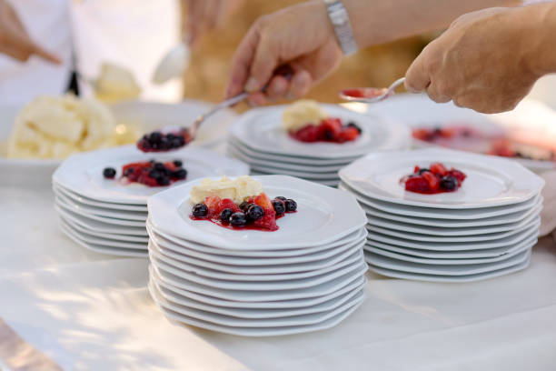 istock Waiter serving plates with dessert 1057369454