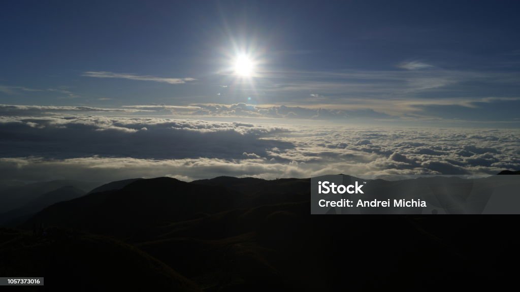 Sunrise view from Mt. Pulag, Philippines Morning sun lighting the mountains around Pulag Peak. Atmospheric Mood Stock Photo