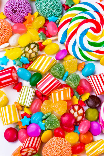 istock Colorful lollipops and different colored round candy. Top view. 1057383126