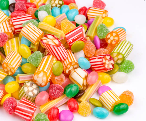 istock Colorful lollipops and different colored round candy. Top view. 1057383150