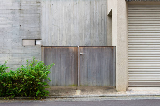 istock sidewalk by street wall & door 1057386528