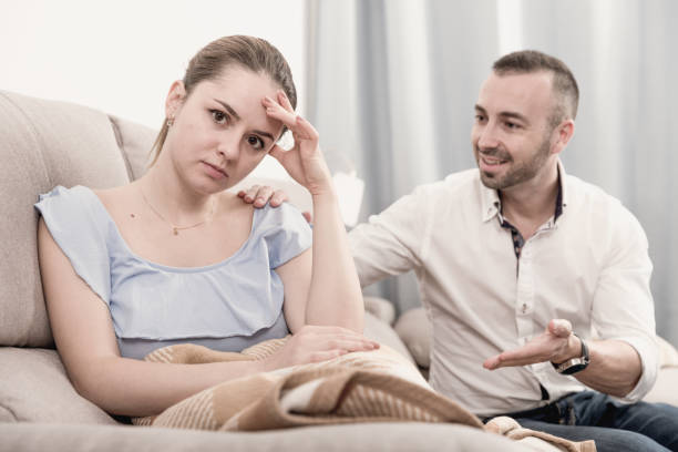 istock Sad female is depressing and husband is supporting her 1057389652