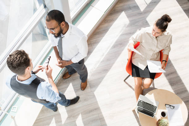 istock Modern business people working in open space office 1057390376