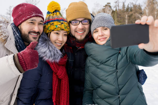 istock Four Friends Posing for Selfie 1057403324