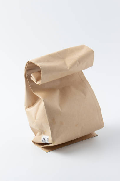 istock Brown paper bag isolated on white background 1057403624