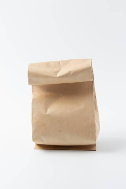 istock Brown paper bag isolated on white background 1057405262