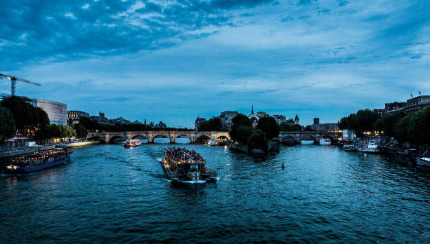 Boats on the Seine at dusk stock photo