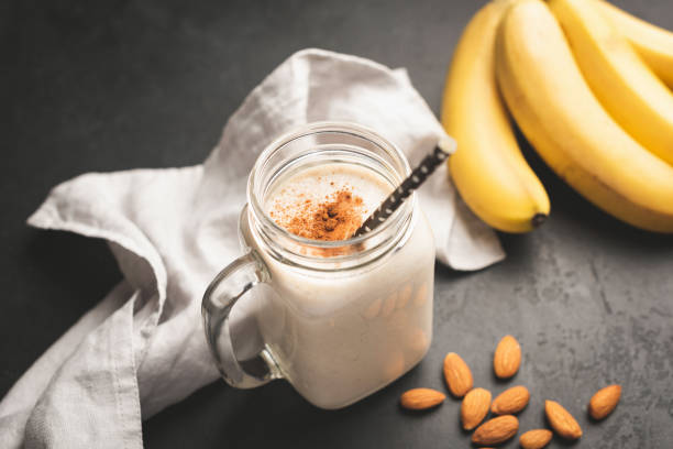 istock Banana smoothie or protein shake in drinking jar 1057423682