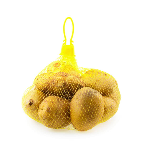 istock Potatoes are in mesh bag isolated on white background 1057431946