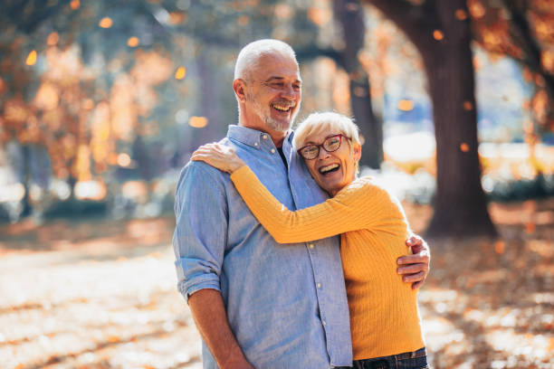 istock Active seniors on a walk in autumn forest 1057433792