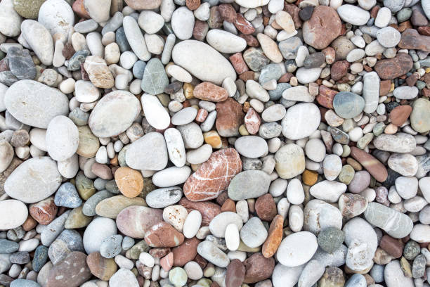 istock Background from sea pebble. Small stones, top view 1057435458