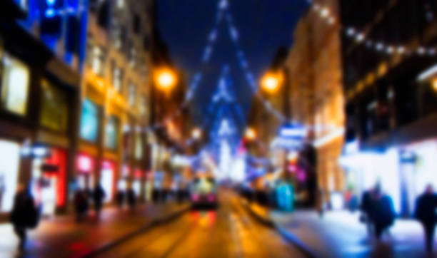 Abstract background of a blur Christmas market. Abstract christmas background with blur. Boke people on the street of the New Year's city. Abstract christmas background with blur. Boke parade stock pictures, royalty-free photos & images