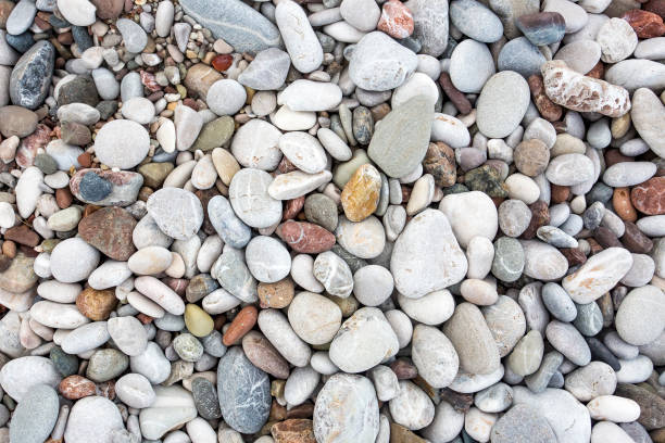 istock Background from sea pebble. Small stones, top view 1057435538