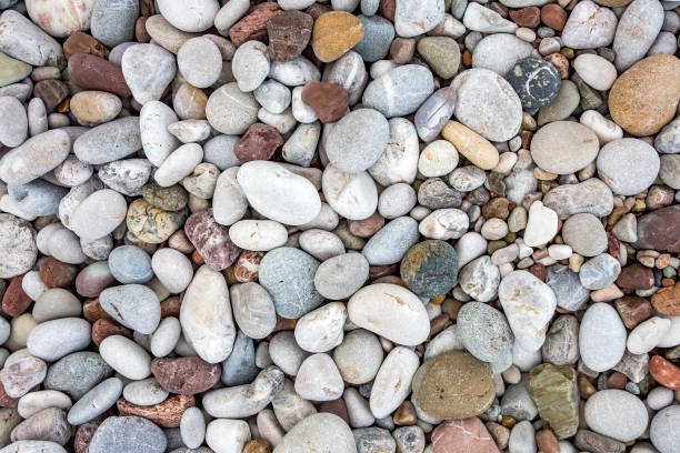 istock Background from sea pebble. Small stones, top view 1057435542