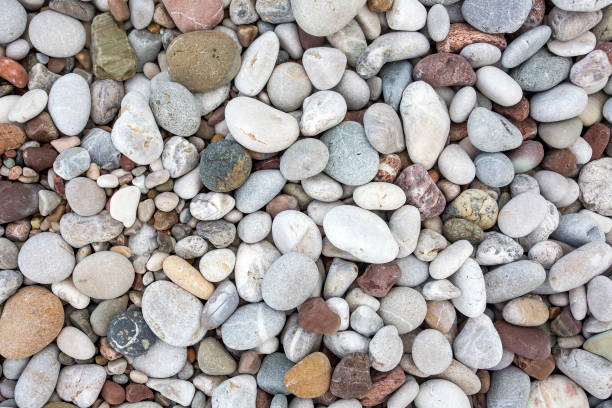 istock Background from sea pebble. Small stones, top view 1057435544