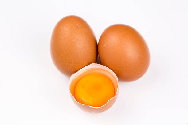 istock Many eggs lie on the background of hay, top view. 1057442126