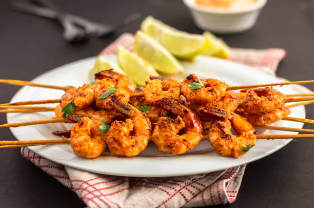 istock Grilled Shrimp / Prawn on a Dark Background 1057443860