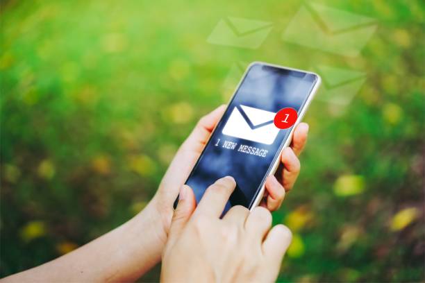 istock Woman hand using smartphone got 1 new message email. Business communication  technology concept. 1057443938