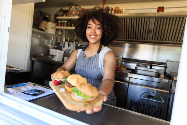 istock Attractive Afro female fast food worker 1057446318