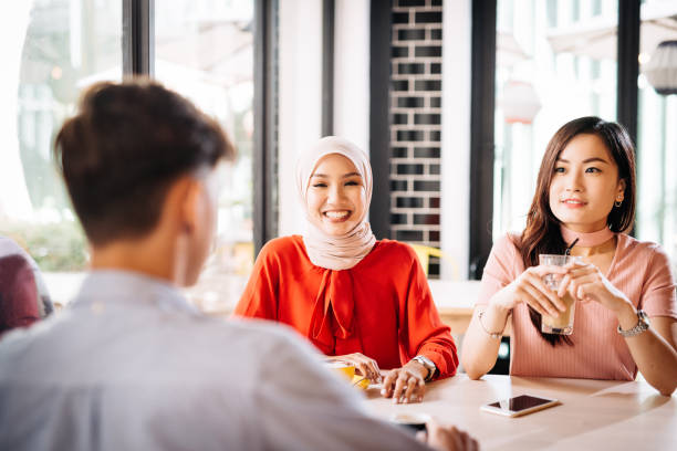 istock Multi-ethnic friends having a break and drinking coffee together 1057449414