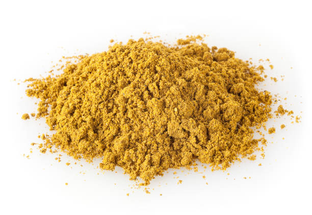 istock Heap of curry powder isolated on white background 1057455344