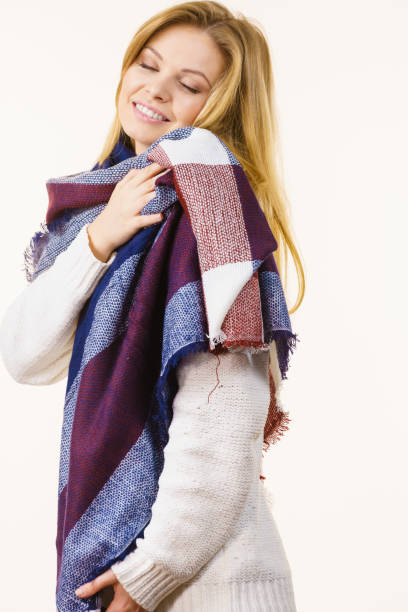 istock Woman wearing warm soft scarf 1057456600