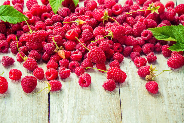 istock Raspberries on a wooden background. Selective focus. Food. 1057459056