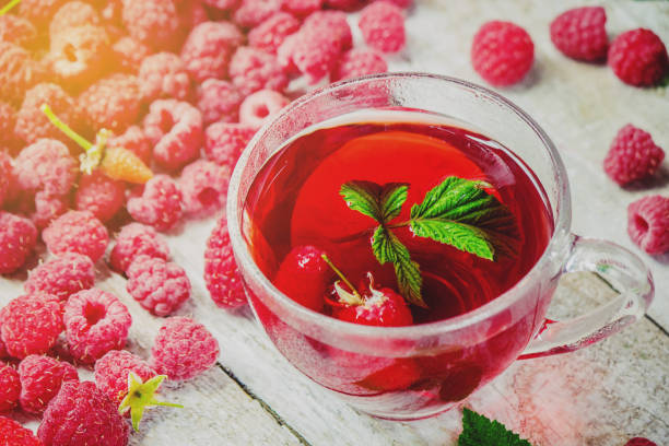 istock Raspberries on a wooden background. Selective focus. Food. 1057459092