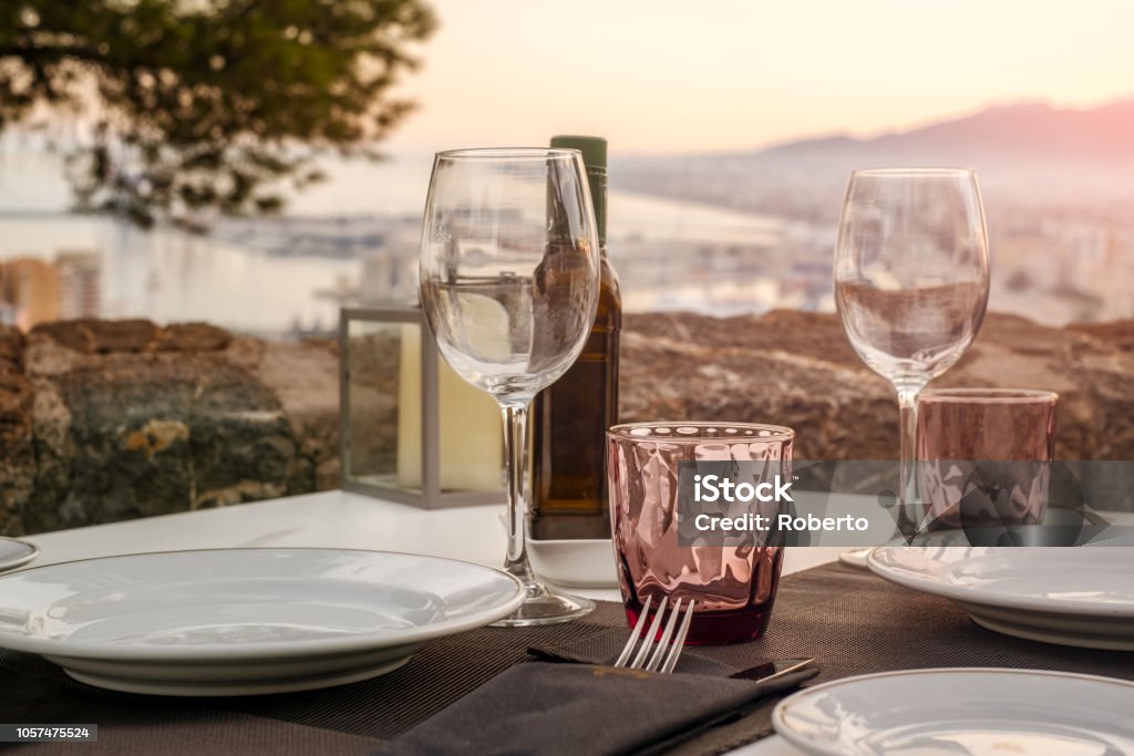 The close-up table in outdoor restaurant w. The close-up table in outdoor restaurant with great view over the Malaga city, Costa del sol, Spain Parador Stock Photo