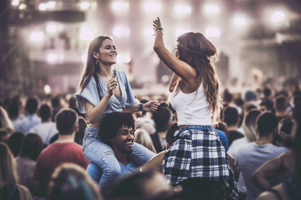 istock Happy couples having fun on a music concert. 1057477948