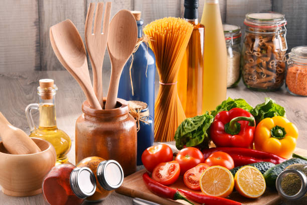 istock Composition with assorted food products and kitchen utensils 1057478172