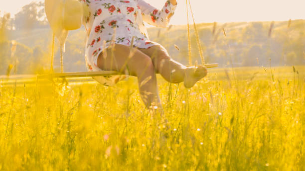 istock Low section of woman on swing 1057482550