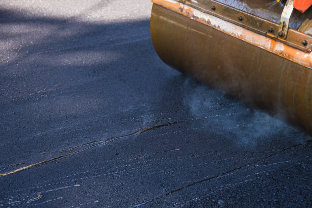 istock laying asphalt on the new road 1057483060
