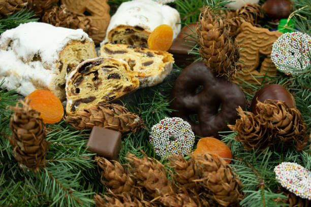 Christmas stollen and christmas cookies on fir branches.