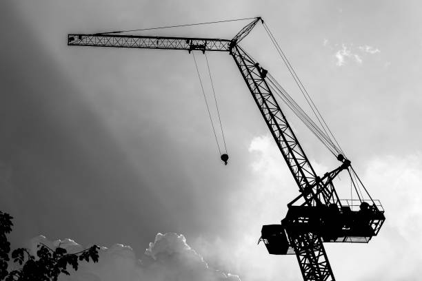 istock Silhouette Big cranes on the sky background 1057483460