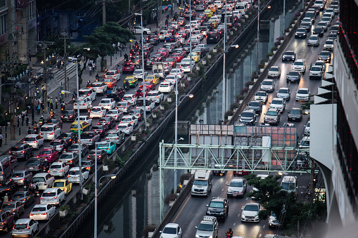 Bangkok Thailand , December 15 , 2017 : Many cars on the road, traffic jam in the city and Bokeh blurred background