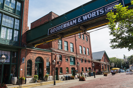 TORONTO, CANADA - SEPTEMBER 18, 2018: Distillery District (former Gooderham & Worts Distillery) - historic and entertainment precinct. It contains numerous cafes, restaurants, shops and industrial parts.