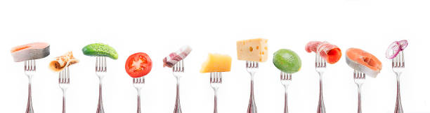 istock A group of products on a fork on white background. 1057487624