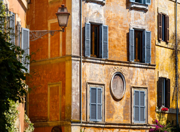 istock Old colorful facade walls and windows, grunge architectural background 1057489314