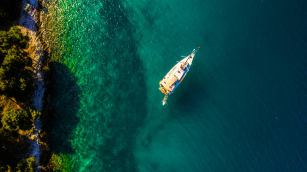 View of yacht on sea on Croatia Aerial view of yacht floating on sea on Croatia dugi otok island stock pictures, royalty-free photos & images