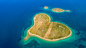 Aerial view of island on Croatia sea. Galesnjak island. Heart Island
